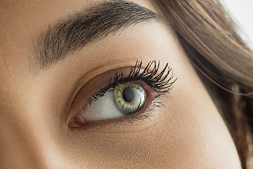 Image showing Close up of face of beautiful caucasian young woman, focus on eyes. Human emotions, facial expression, cosmetology, body and skin care concept.