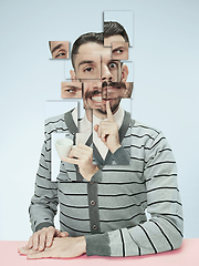 Image showing Surreal portrait of man made of different pieces of photos. Art collage.