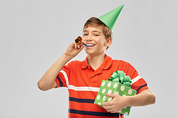 Image showing happy boy in party hat with birthday gift box