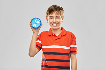 Image showing portrait of happy smiling boy with alarm clock