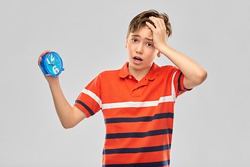 Image showing portrait of boy with alarm clock