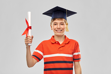 Image showing graduate student boy in mortarboard with diploma