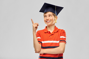 Image showing graduate student boy in mortarboard with finger up