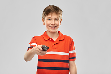 Image showing smiling boy with tv remote control