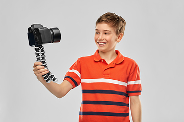 Image showing boy video blogger with camera and tripod