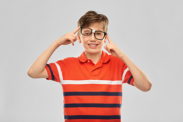 Image showing portrait of happy smiling boy in crooked glasses