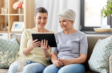 Image showing daughter and senior mother with tablet pc at home