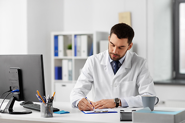 Image showing male doctor with clipboard at hospital