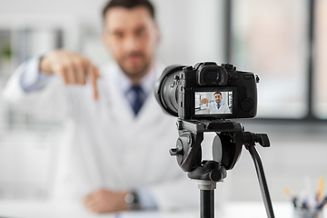 Image showing male doctor recording video blog at hospital