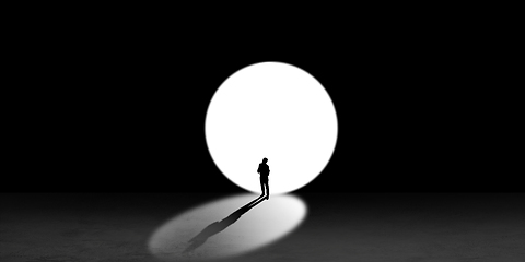 Image showing Silhouette of man walking in the night toward the light, view from above