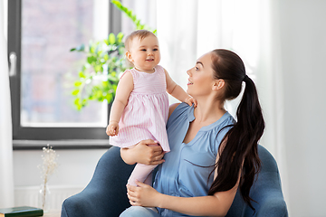 Image showing happy mother with little baby daughter at home