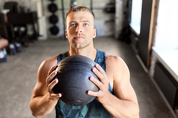 Image showing young man with medicine ball in gym