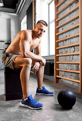 Image showing young man with medicine ball in gym