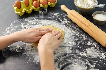 Image showing hands making shortcrust pastry dough on table