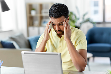 Image showing indian man with laptop working at home office