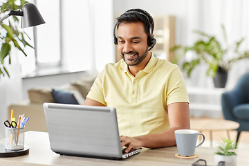 Image showing indian man with headset and laptop working at home