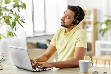 Image showing indian man with headset and laptop working at home