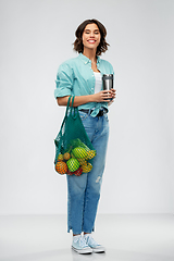 Image showing happy smiling woman with food in reusable net bag