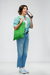 Image showing woman with bag for food shopping and tumbler