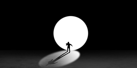 Image showing Silhouette of man walking in the night toward the light, view from above