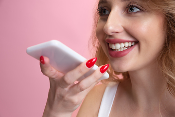 Image showing Caucasian young woman\'s portrait isolated on pink studio background. Beautiful female model. Concept of human emotions, facial expression, sales, ad, youth culture.