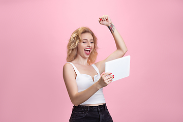 Image showing Caucasian young woman\'s portrait isolated on pink studio background. Beautiful female model. Concept of human emotions, facial expression, sales, ad, youth culture.