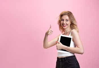 Image showing Caucasian young woman\'s portrait isolated on pink studio background. Beautiful female model. Concept of human emotions, facial expression, sales, ad, youth culture.