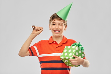 Image showing happy boy in party hat with birthday gift box