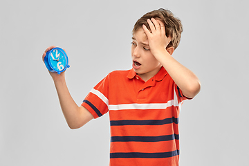 Image showing portrait of boy with alarm clock