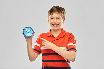 Image showing portrait of happy smiling boy with alarm clock