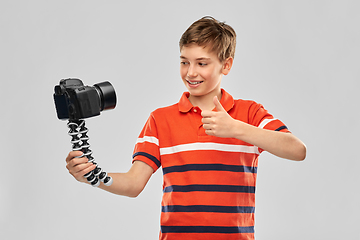 Image showing boy video blogger with camera showing thumbs up