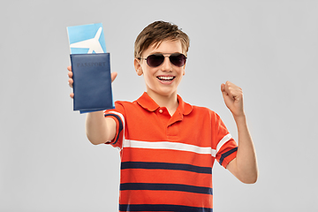 Image showing happy boy in sunglasses with ticket and passport