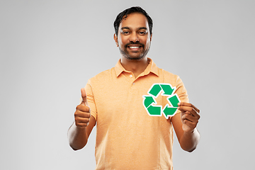 Image showing smiling indian man holding green recycling sign