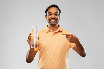 Image showing happy indian man showing water in glass bottle