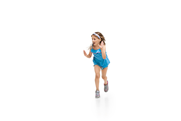 Image showing Happy little caucasian girl jumping and running isolated on white background