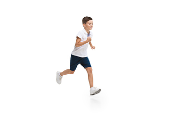 Image showing Happy little caucasian boy jumping and running isolated on white background