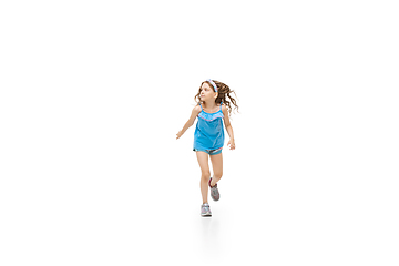 Image showing Happy little caucasian girl jumping and running isolated on white background