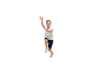 Image showing Happy little caucasian boy jumping and running isolated on white background