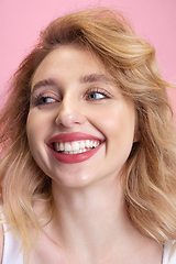 Image showing Caucasian young woman\'s portrait isolated on pink studio background. Beautiful female model. Concept of human emotions, facial expression, sales, ad, youth culture.