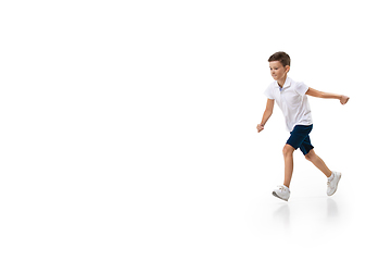 Image showing Happy little caucasian boy jumping and running isolated on white background