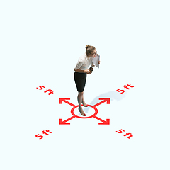 Image showing Studio shot of people demonstrating social distancing with arrows indicating the separation.