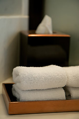 Image showing pile of towels in a hotel bathroom