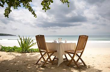 Image showing table and chairs on a beach