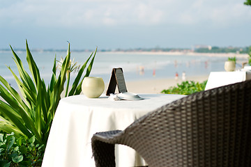 Image showing table and chair on a beach