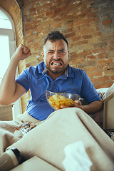 Image showing Lazy man living the whole life in his bed surrounded with messy