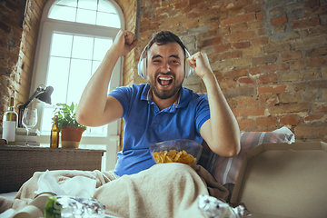 Image showing Lazy man living the whole life in his bed surrounded with messy