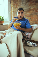 Image showing Lazy man living the whole life in his bed surrounded with messy