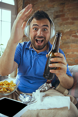 Image showing Lazy man living the whole life in his bed surrounded with messy