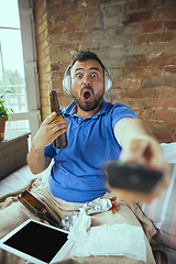 Image showing Lazy man living the whole life in his bed surrounded with messy