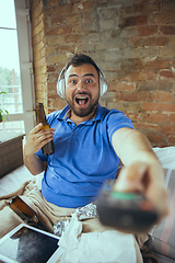 Image showing Lazy man living the whole life in his bed surrounded with messy